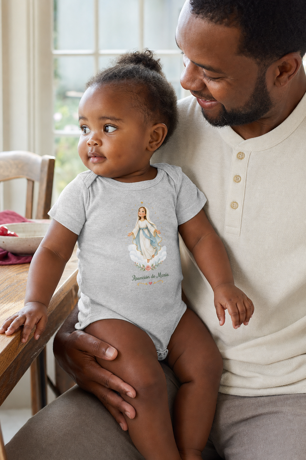 Baby girl wearing the Asunción de María Baby Bodysuit in Athletic Heather