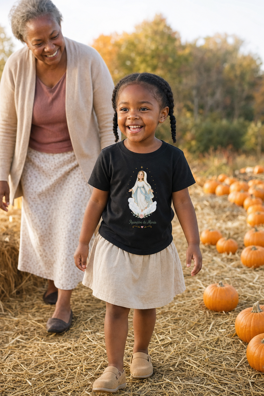 Little girl wearing the Asunción de María Toddler T-Shirt in Black