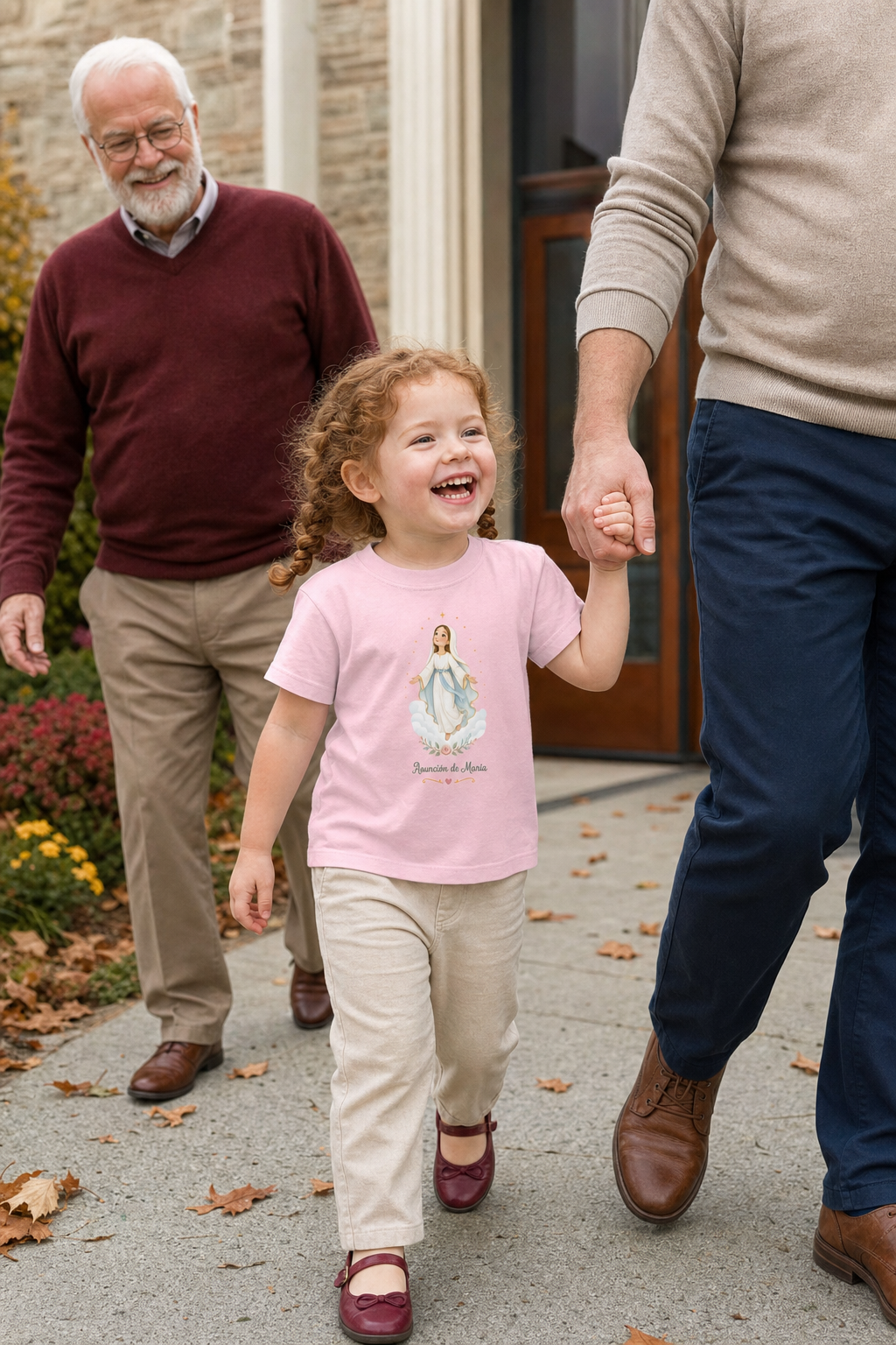 Little girl wearing the Asunción de María Toddler T-Shirt in Pink