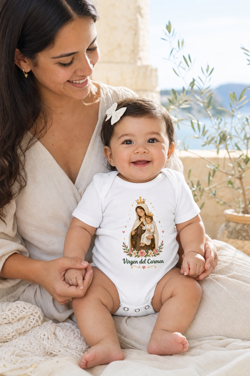 Baby girl wearing the Virgen del Carmen bodysuit in a lifestyle setting