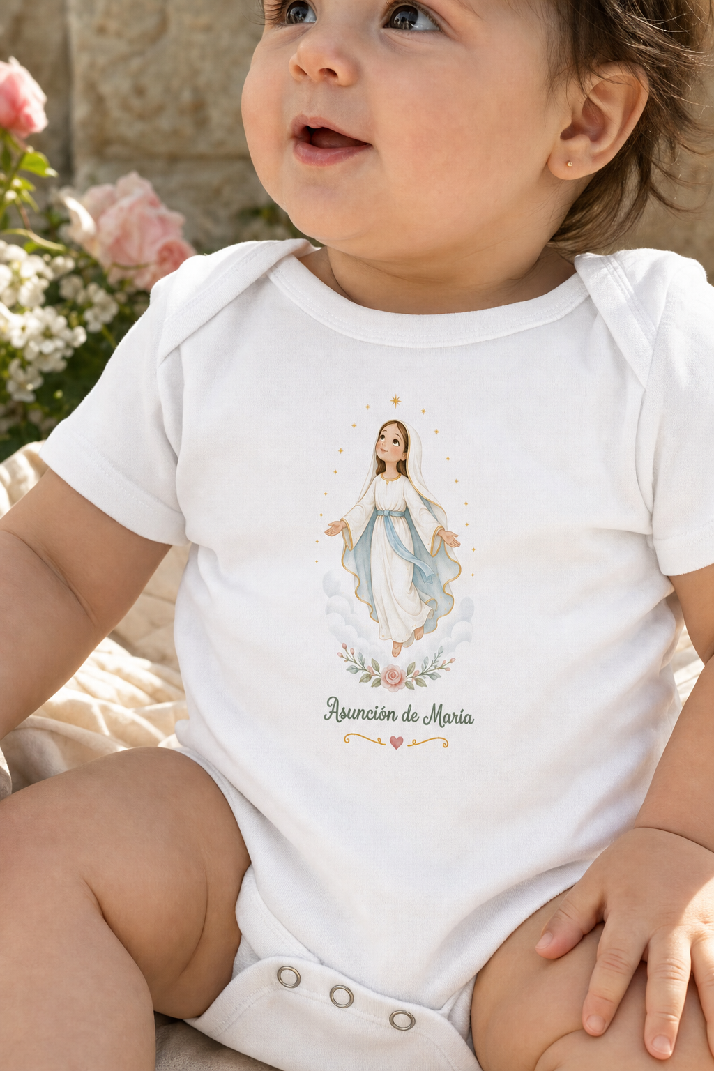 Baby girl wearing the Asunción de María bodysuit in a lifestyle setting — detail