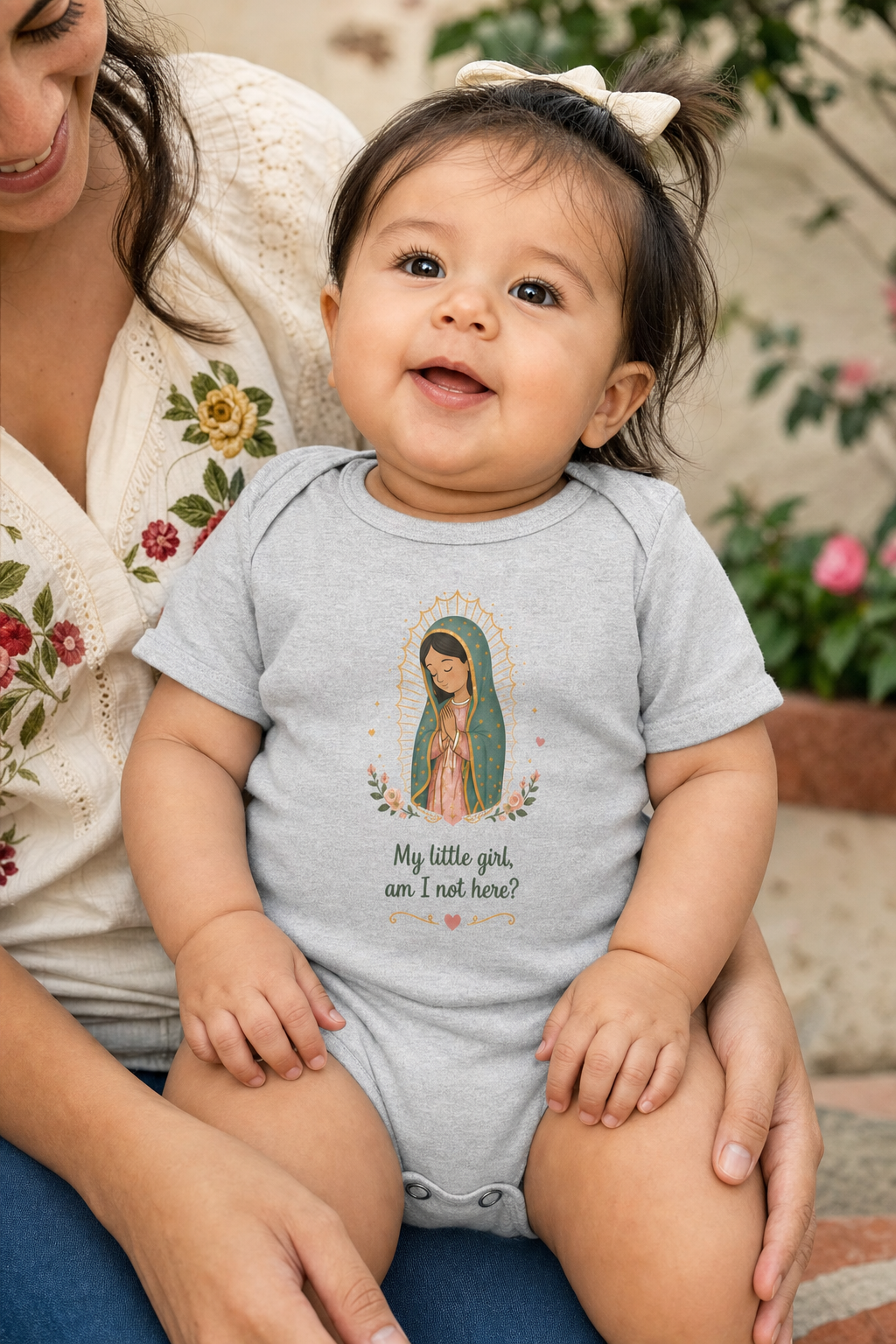 Baby girl wearing the My Little Girl Guadalupe bodysuit in a lifestyle setting — detail
