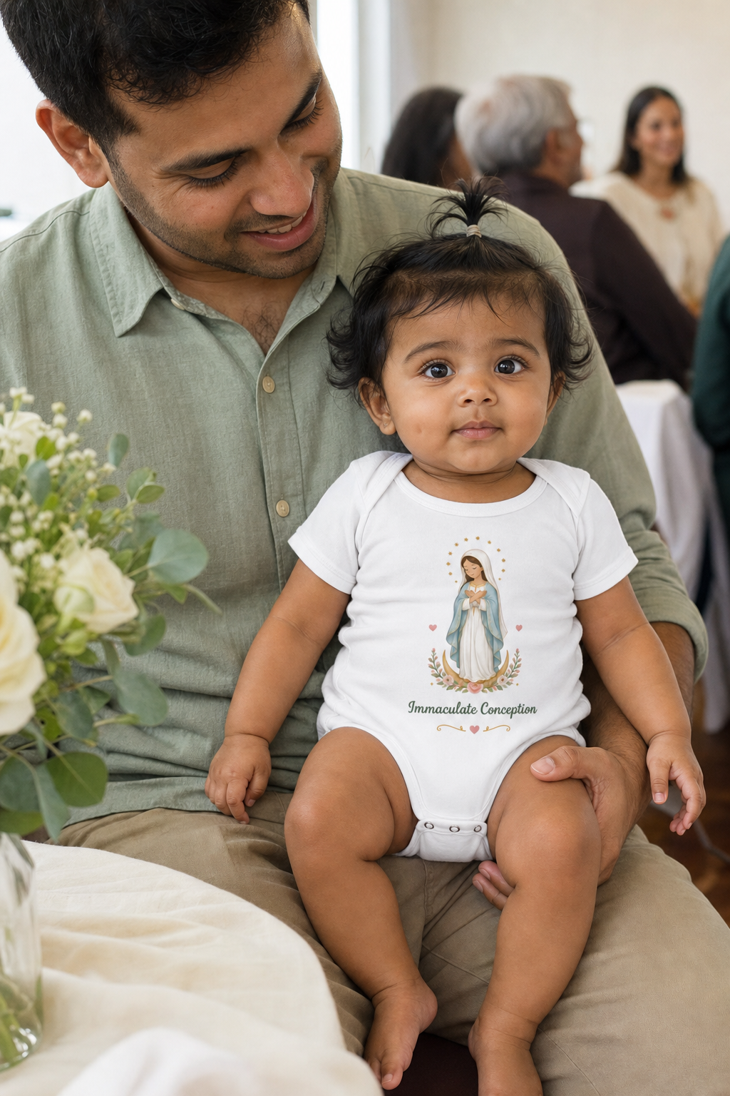 Baby girl wearing the Immaculate Conception Baby Bodysuit in White
