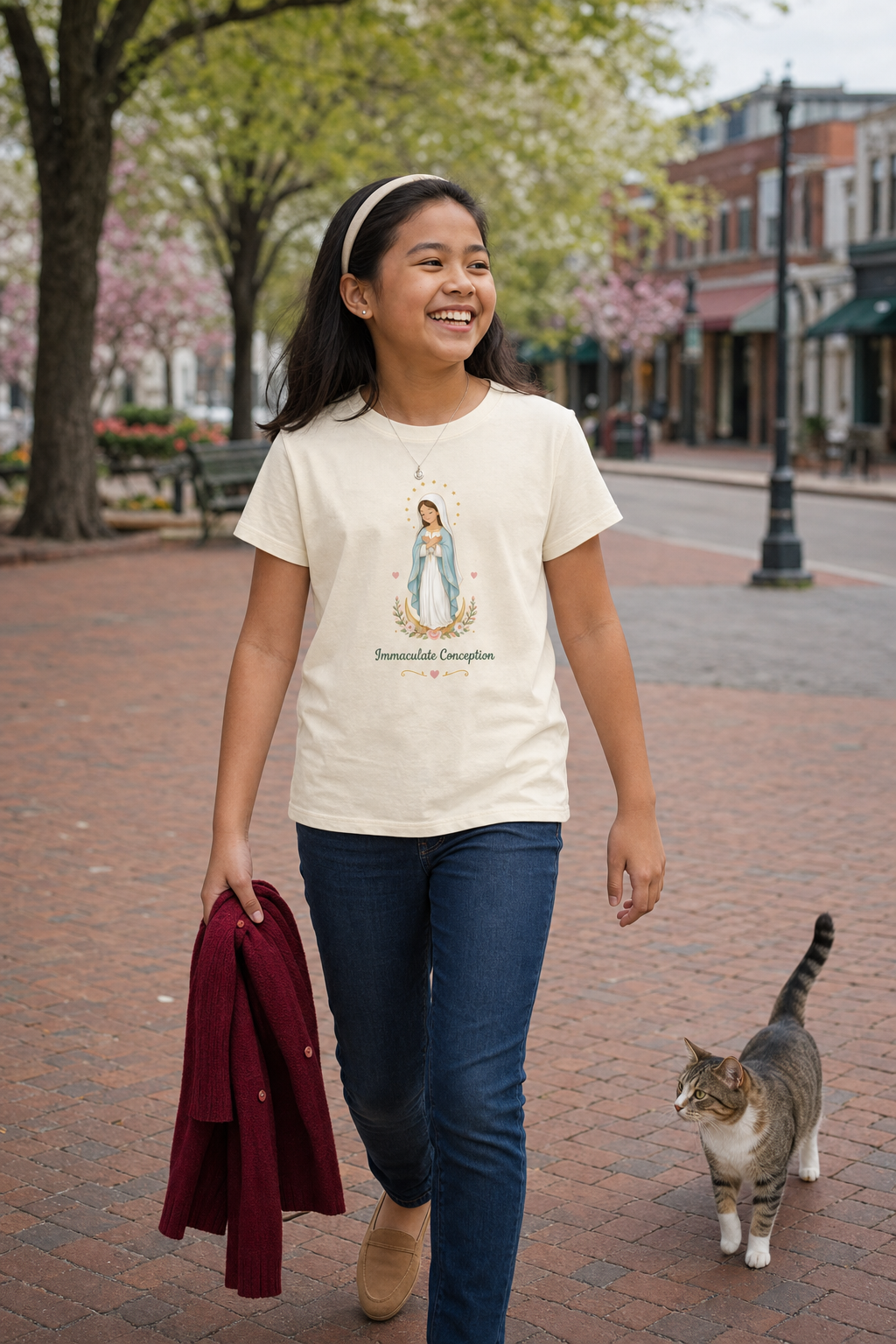 Girl wearing the Immaculate Conception Girls T-Shirt in Natural