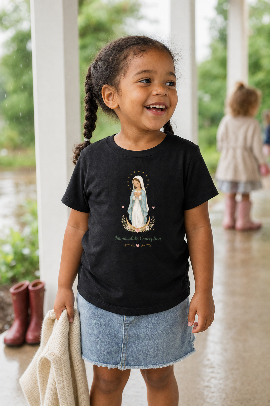 Little girl wearing the Immaculate Conception Toddler T-Shirt in Black