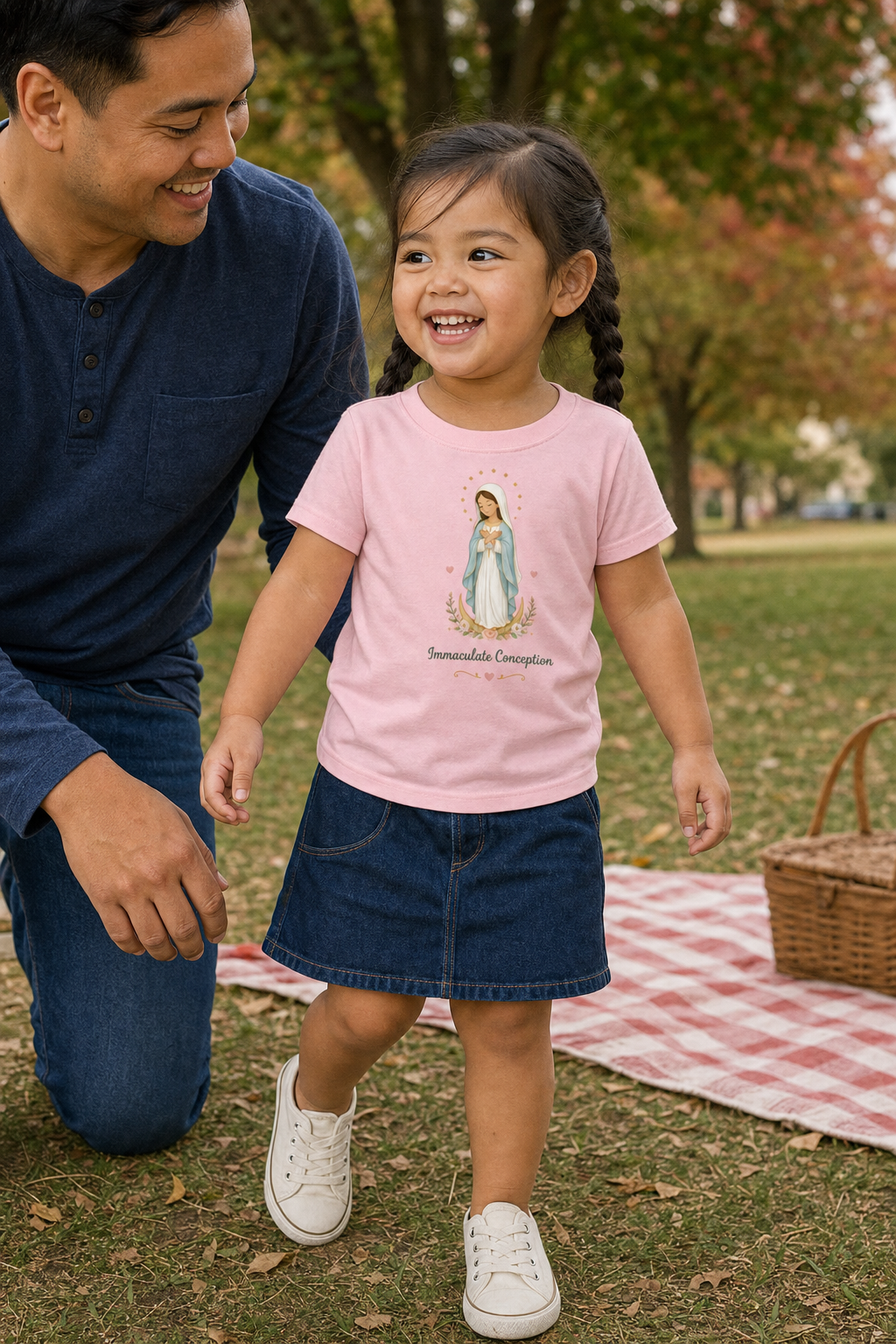 Little girl wearing the Immaculate Conception Toddler T-Shirt in Pink