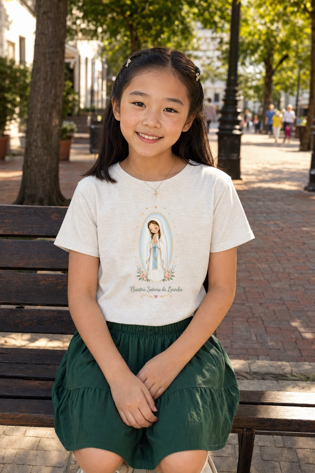 Girl wearing the Nuestra Señora de Lourdes Girls T-Shirt in Heather Dust