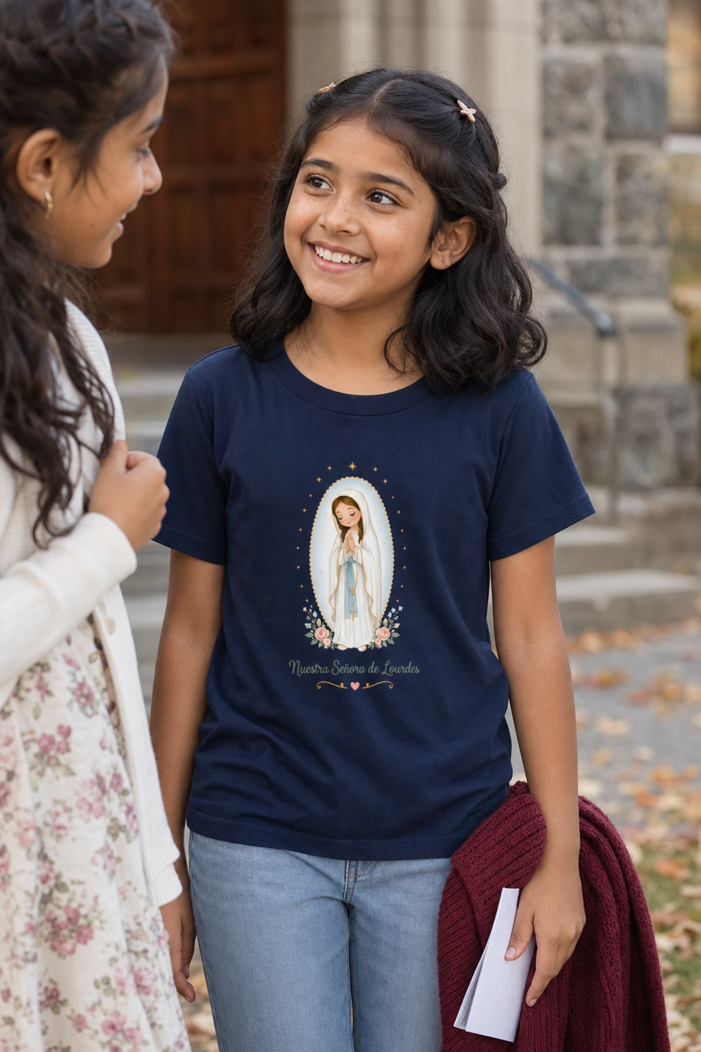 Girl wearing the Nuestra Señora de Lourdes Girls T-Shirt in Navy