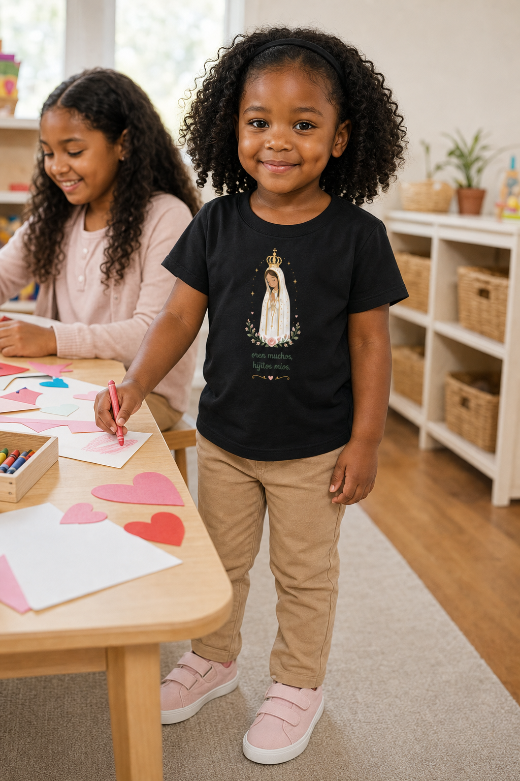 Little girl wearing the Oren Muchos Fátima Toddler T-Shirt in Black