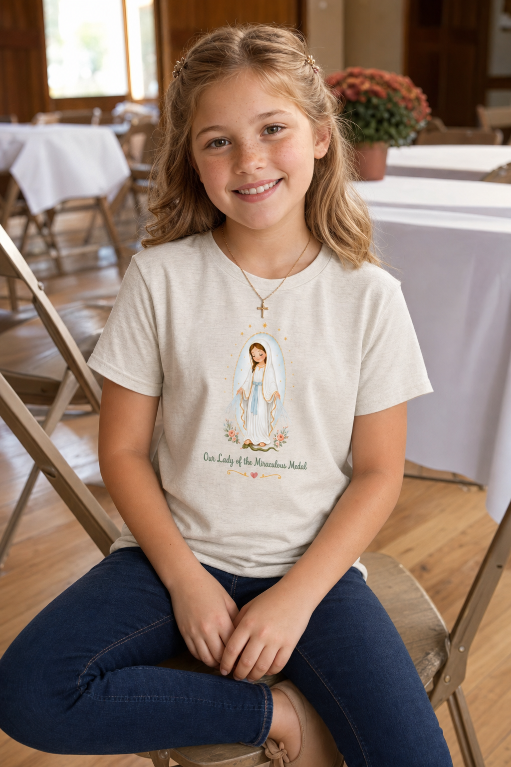 Girl wearing the Our Lady of the Miraculous Medal Girls T-Shirt in Heather Dust