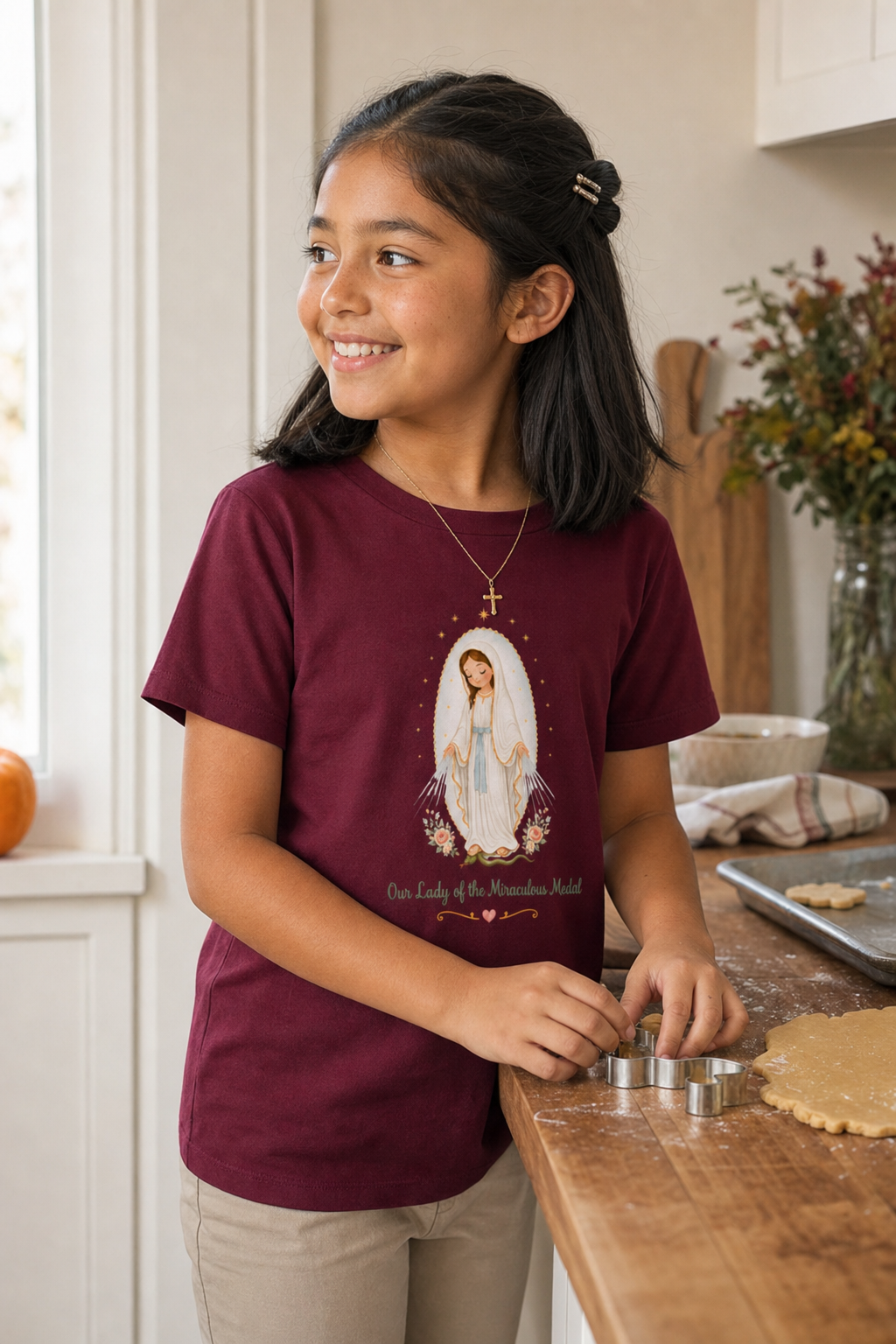 Girl wearing the Our Lady of the Miraculous Medal Girls T-Shirt in Maroon