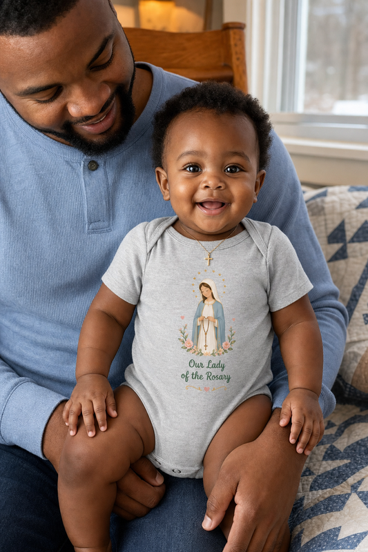 Baby girl wearing the Our Lady of the Rosary Baby Bodysuit in Athletic Heather