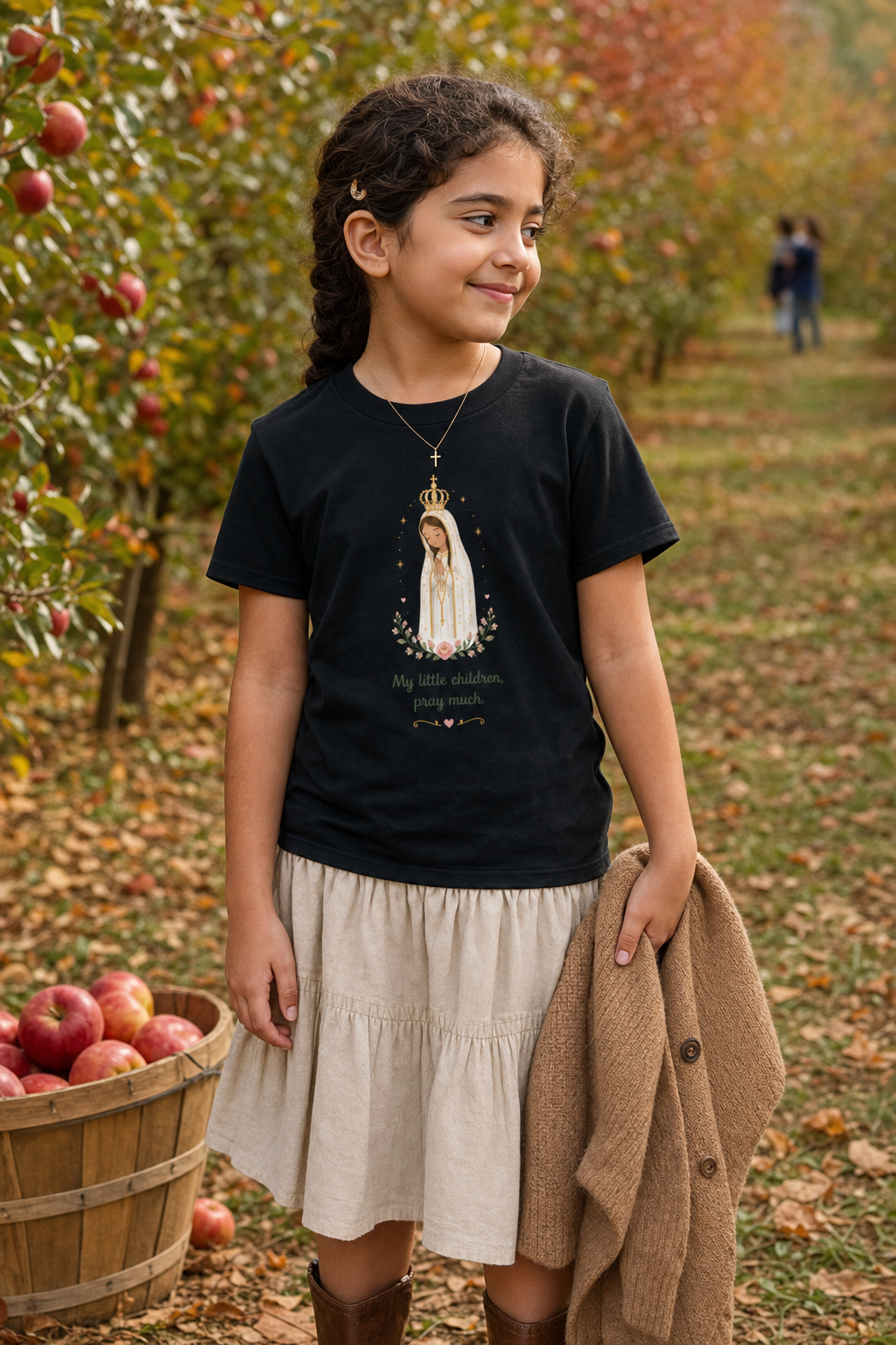 Girl wearing the Pray Much Fátima Girls T-Shirt in Black