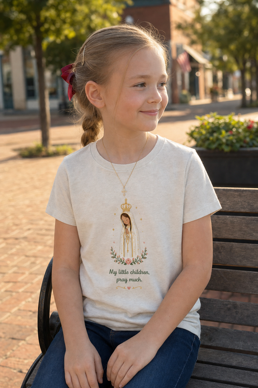 Girl wearing the Pray Much Fátima Girls T-Shirt in Heather Dust
