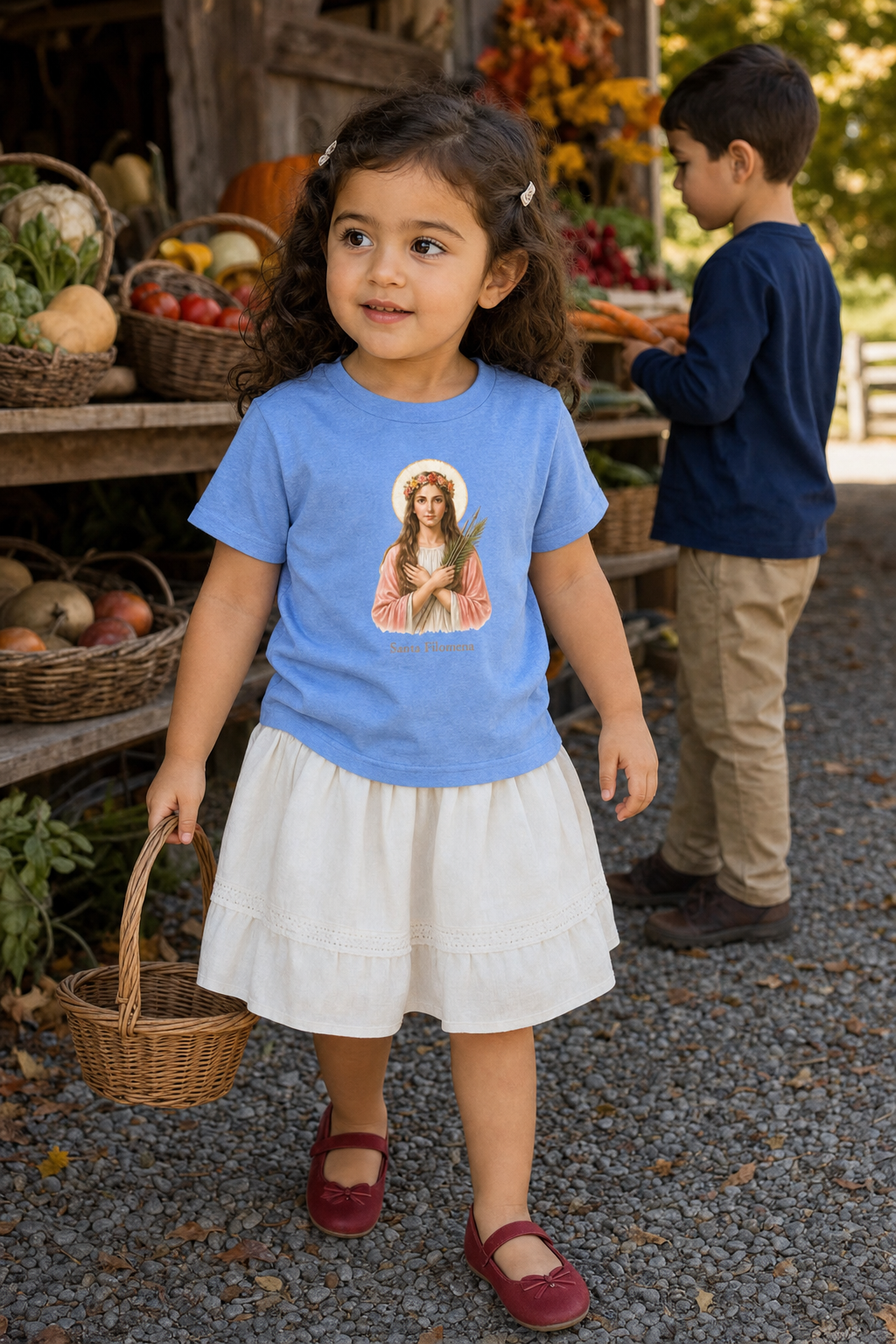 Little girl wearing the Santa Filomena Toddler T-Shirt in Heather Columbia Blue