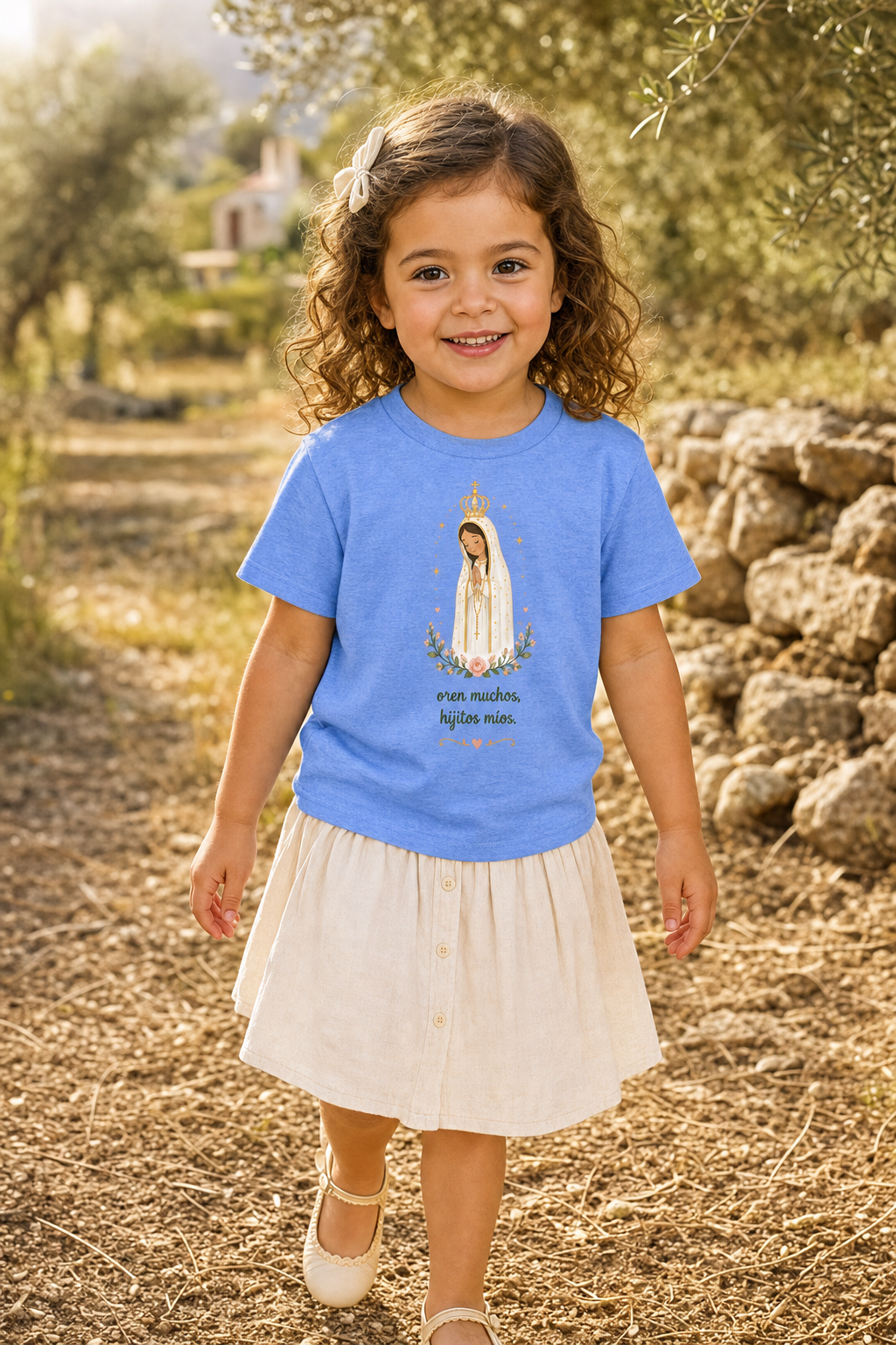 Little girl wearing the Oren Muchos Fátima toddler T-shirt in a lifestyle setting