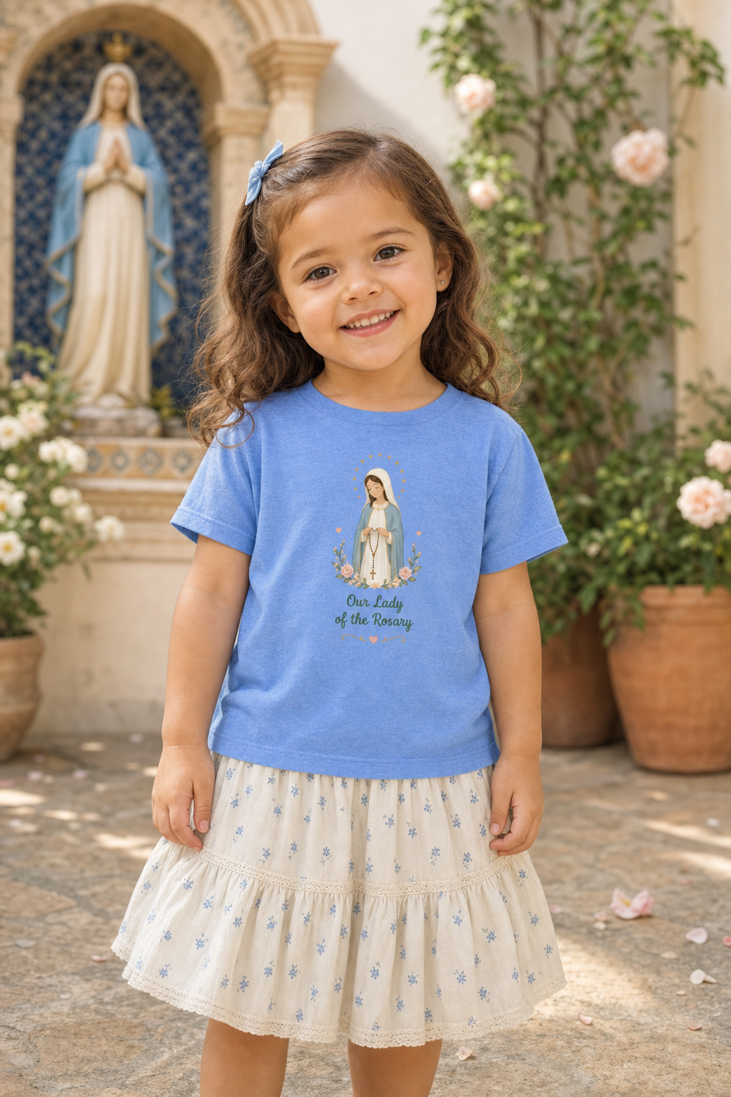 Little girl wearing the Our Lady of the Rosary toddler T-shirt in a lifestyle setting
