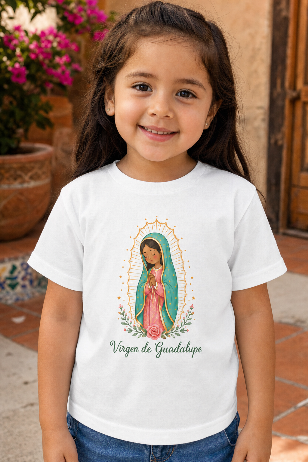 Little girl wearing the Virgen de Guadalupe toddler T-shirt in a lifestyle setting — detail