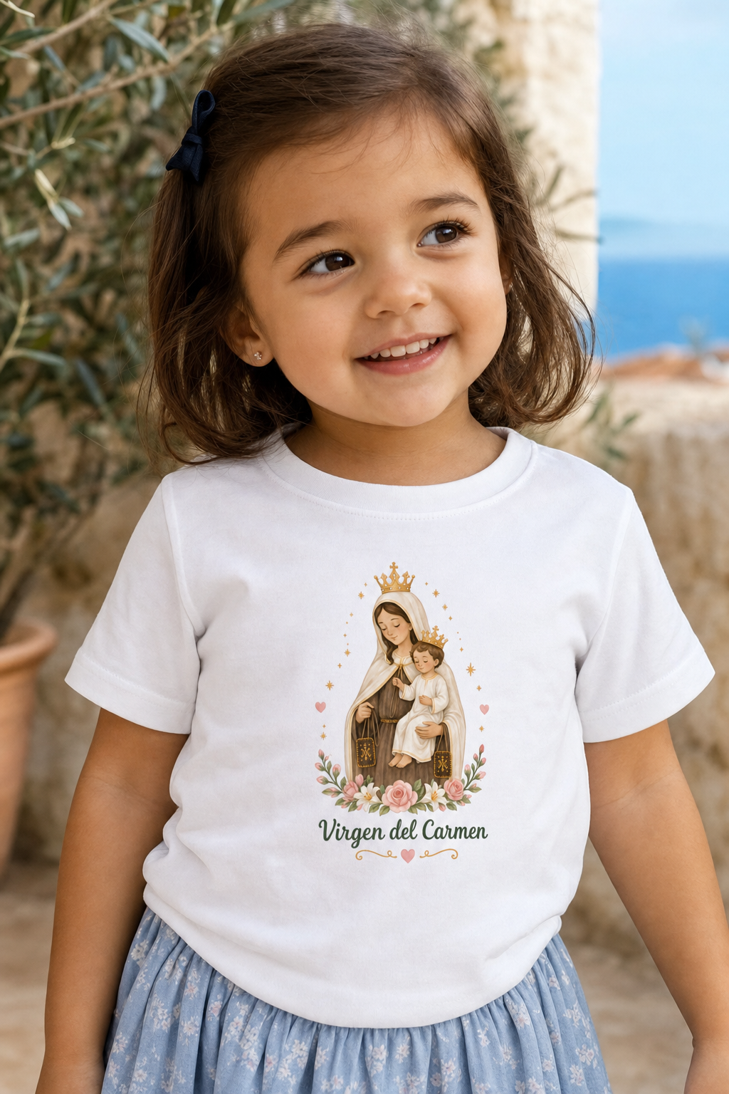 Little girl wearing the Virgen del Carmen toddler T-shirt in a lifestyle setting — detail