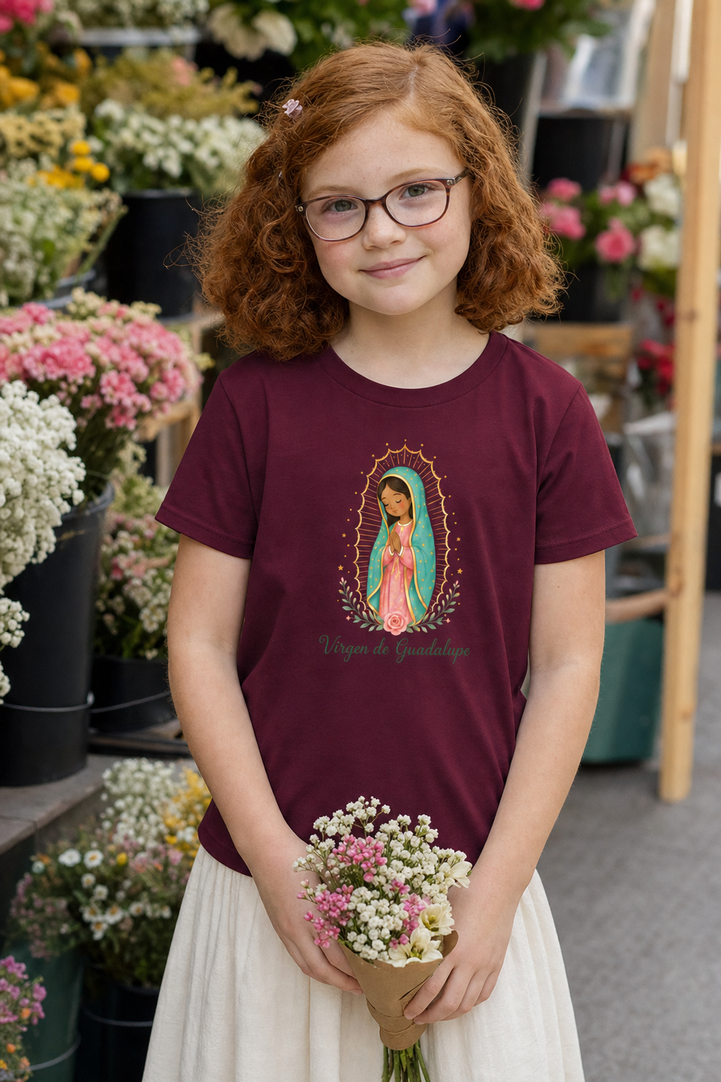 Girl wearing the Virgen de Guadalupe Girls T-Shirt in Maroon