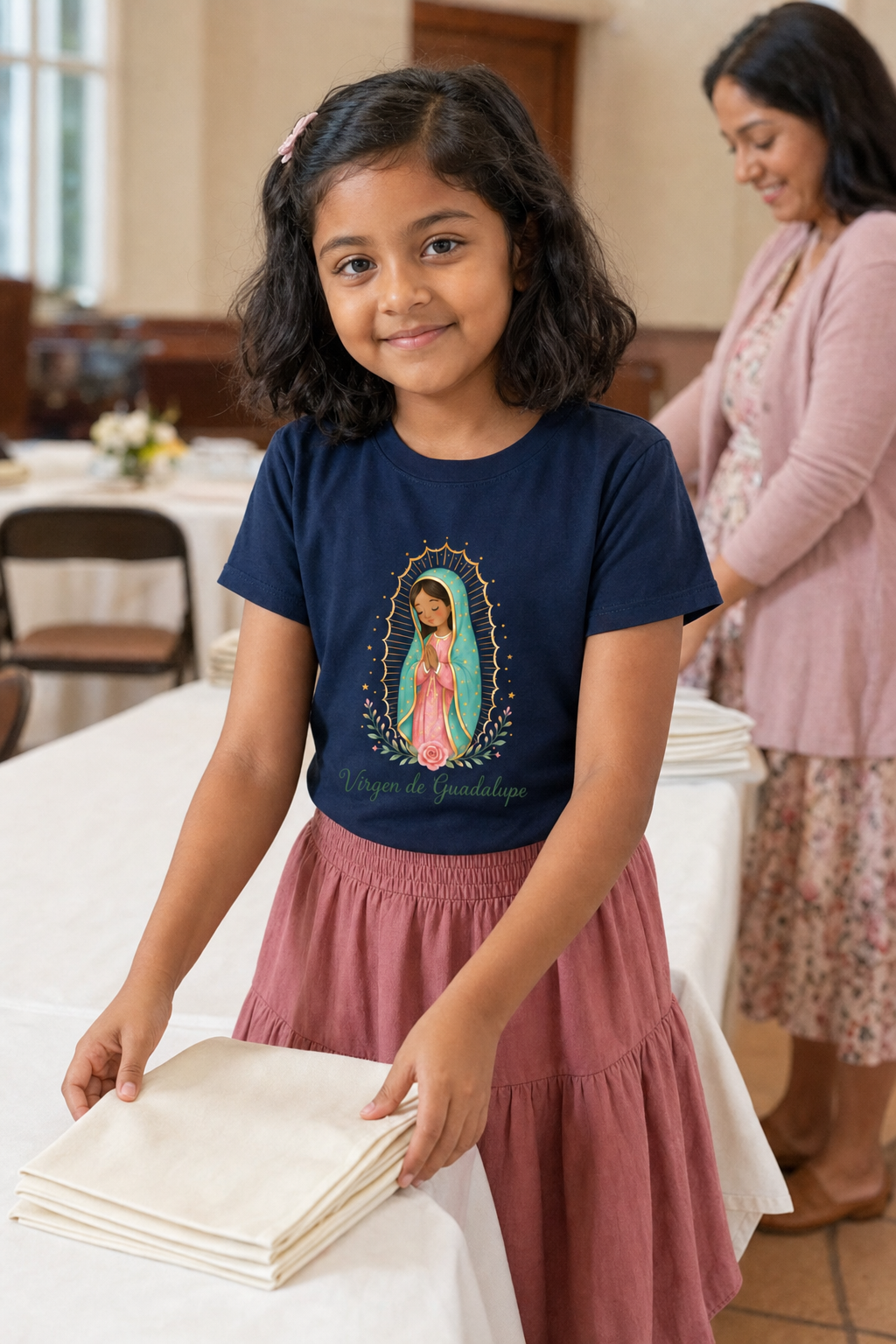 Girl wearing the Virgen de Guadalupe Girls T-Shirt in Navy