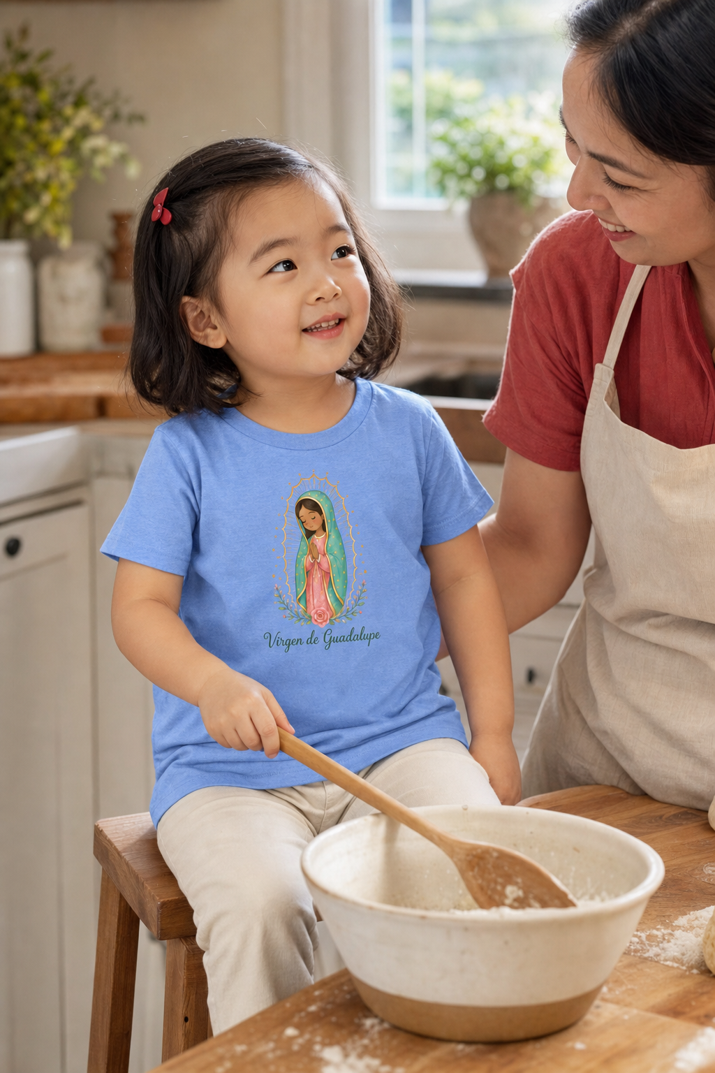 Little girl wearing the Virgen de Guadalupe Toddler T-Shirt in Heather Columbia Blue