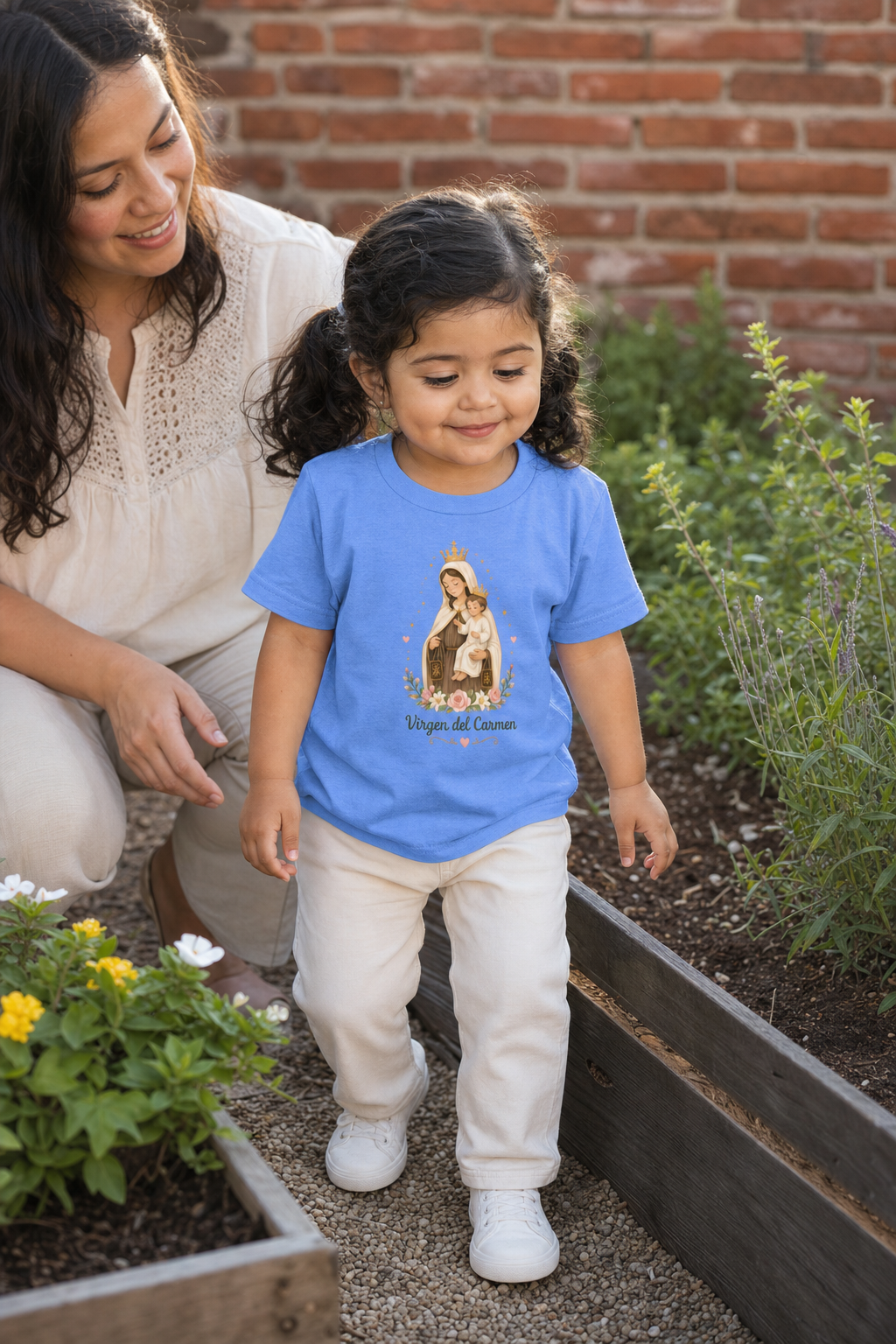 Little girl wearing the Virgen del Carmen Toddler T-Shirt in Heather Columbia Blue