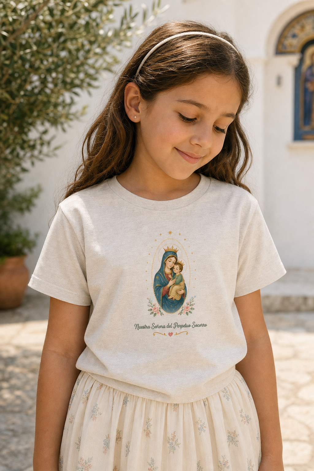 Girl wearing the Nuestra Señora del Perpetuo Socorro Girls T-shirt in a lifestyle setting — detail